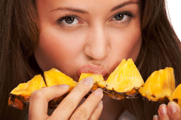 woman-eating-fresh-pineapple